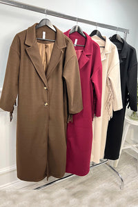 Longline coat with classic notched lapel collar & tiered fringe details at back