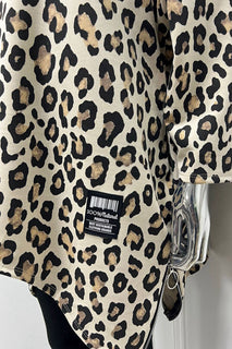 Flowy asymmetric tunic with a bold leopard print and zip-detailed hem