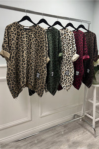 Flowy asymmetric tunic with a bold leopard print and zip-detailed hem
