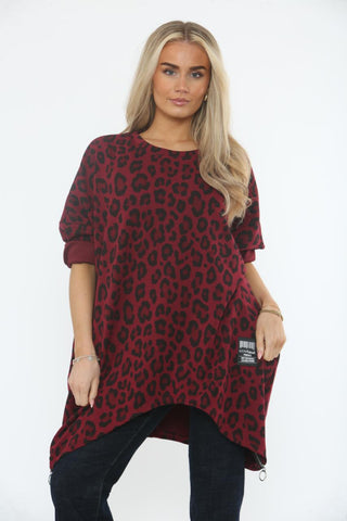 Flowy asymmetric tunic with a bold leopard print and zip-detailed hem