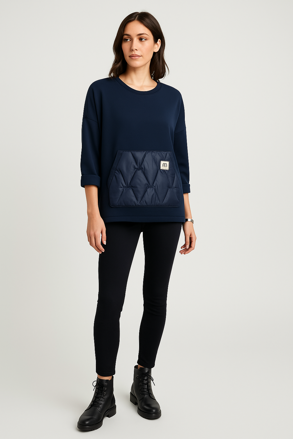Navy quilt pocket sweatshirt — sporty-chic comfort with a bold textured front detail.