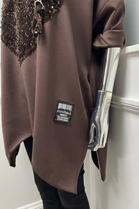 Sequin heart tunic — oversized comfort meets bold sparkle with a zip accent twist.