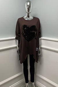 Sequin heart tunic — oversized comfort meets bold sparkle with a zip accent twist.