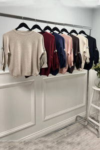 Soft blush knit — puff sleeves with crystal accents