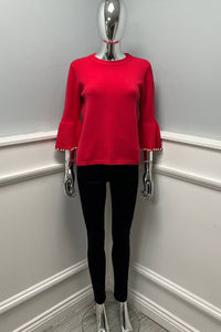 Knitted Jumper with statement flared sleeves detailed with pearl trims