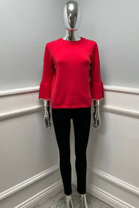 Knitted Jumper with statement flared sleeves detailed with pearl trims
