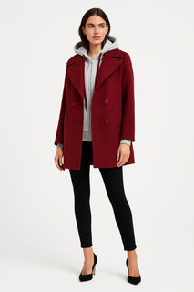 double-breasted coat layered with a hoodie