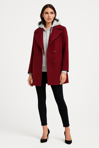 double-breasted coat layered with a hoodie