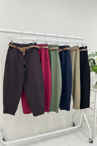 high-waisted tapered fit trousers with a paperbag-style elastic waistband.