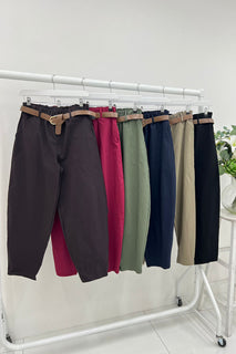 high-waisted tapered fit trousers with a paperbag-style elastic waistband.
