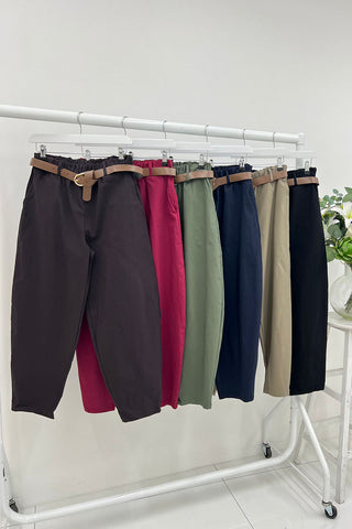 high-waisted tapered fit trousers with a paperbag-style elastic waistband.