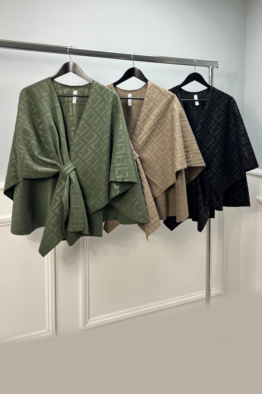 Medium-weight jacquard knit fabric, monogram pattern. With structured drape