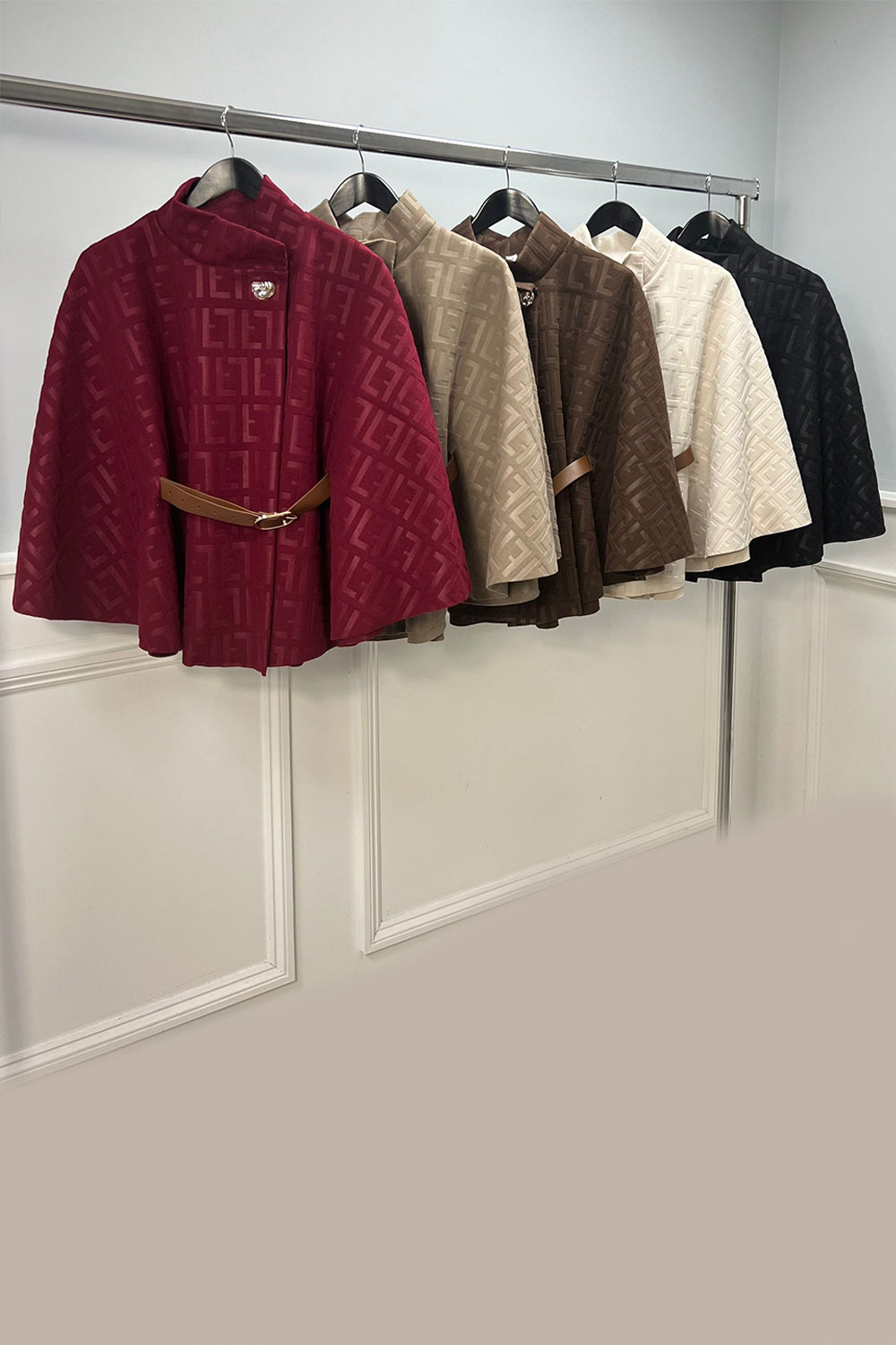 cape-style jacket with a subtle embossed pattern & high, stand-up collar