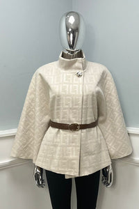 cape-style jacket with a subtle embossed pattern & high, stand-up collar