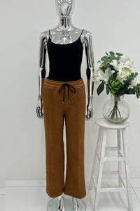 Relaxed, wide-leg fit with an elasticated waistband and adjustable drawstring