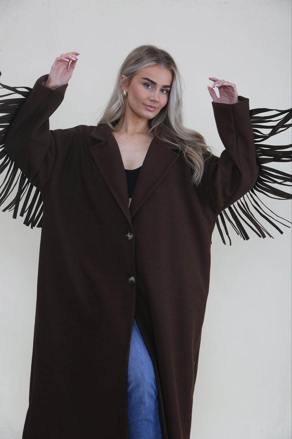 Longline coat with classic notched lapel collar & tiered fringe details at back