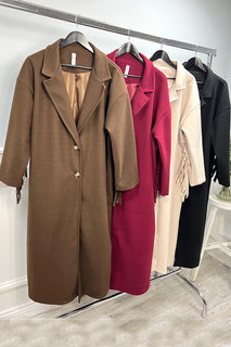 Longline coat with classic notched lapel collar & tiered fringe details at back