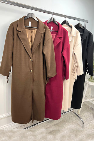 Longline coat with classic notched lapel collar & tiered fringe details at back