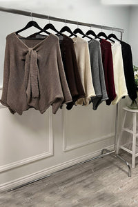 Oversized , V-neck ,knitted jumper with front tie-knot detail