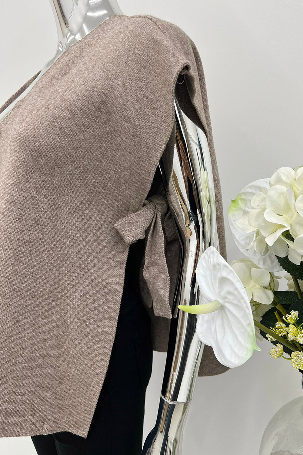 V-neck , sleeveless waistcoat with gold-toned buttons