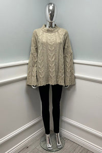 Oversized Cable knit jumper with wide and flared sleeves at the cuffs