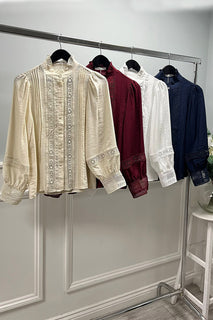 Lace top with pin tuck detailing & a high ruffled collar,  softly puffed sleeves