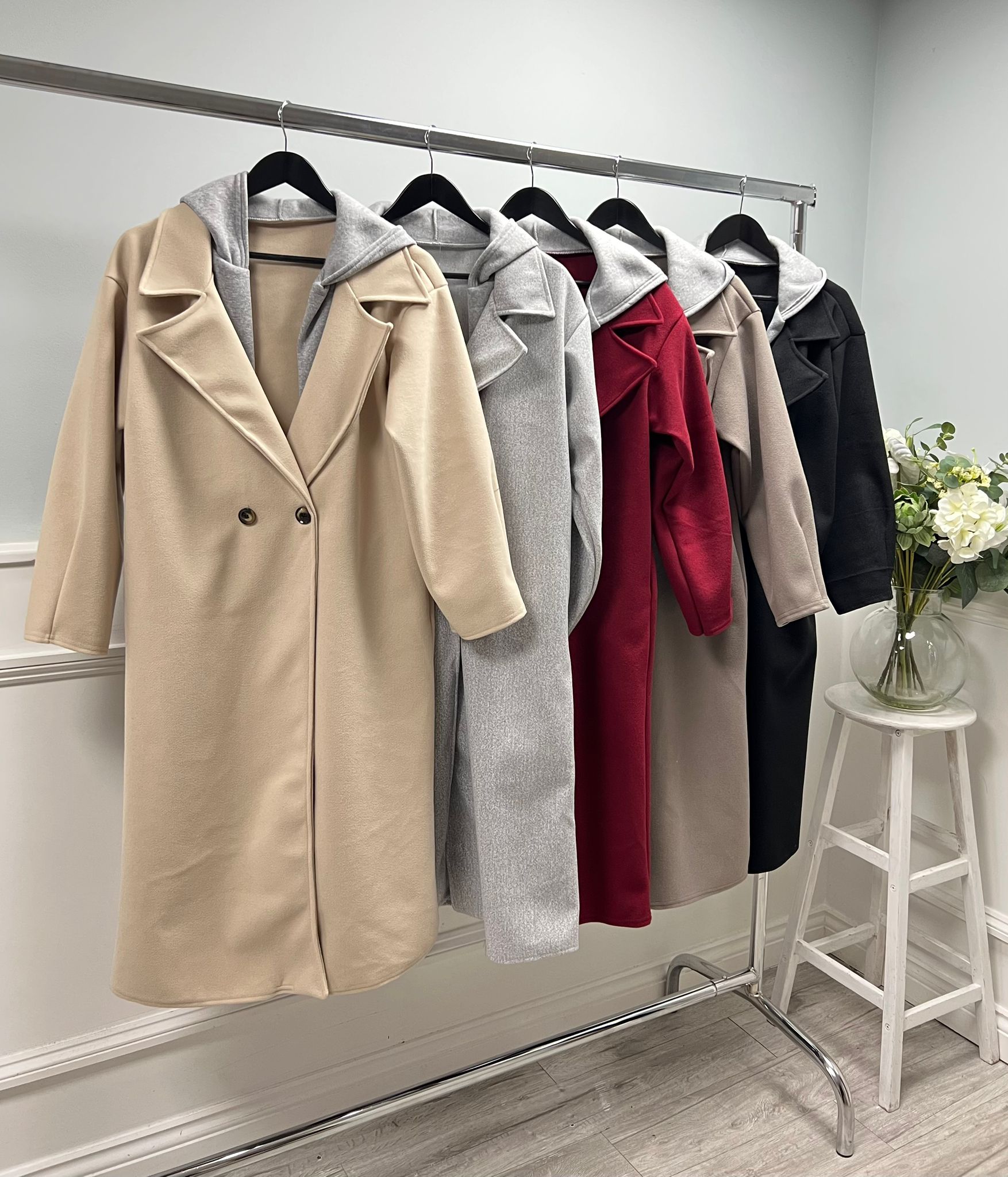 Long tailored coat with wide lapels and a single-button closure