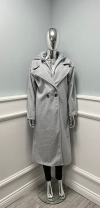 Long tailored coat with wide lapels and a single-button closure