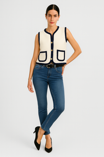 sleeveless cardigan with navy braided trim and front patch pockets.