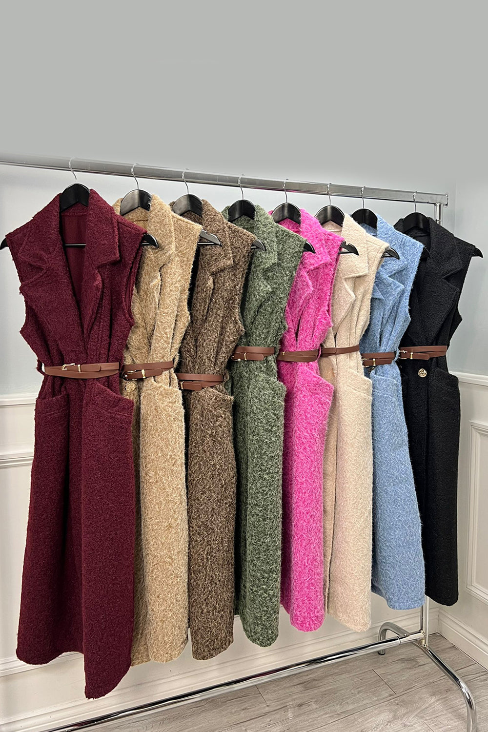 sleeveless teddy jacket with a double-breasted front adorned with gold-tone buttons