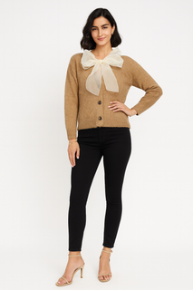 soft knit top with a charming organza bow at the neckline