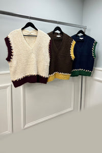 sleeveless knitted jumpers with contrast braided edging