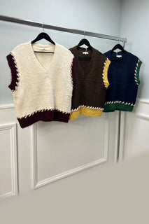 sleeveless knitted jumpers with contrast braided edging
