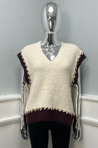 sleeveless knitted jumpers with contrast braided edging