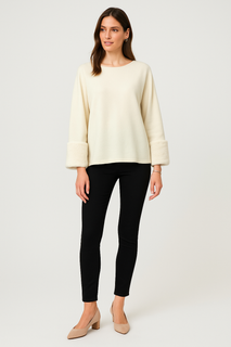 Cream luxe top — soft-touch fabric with plush faux fur cuffs for an elegant winter finish.