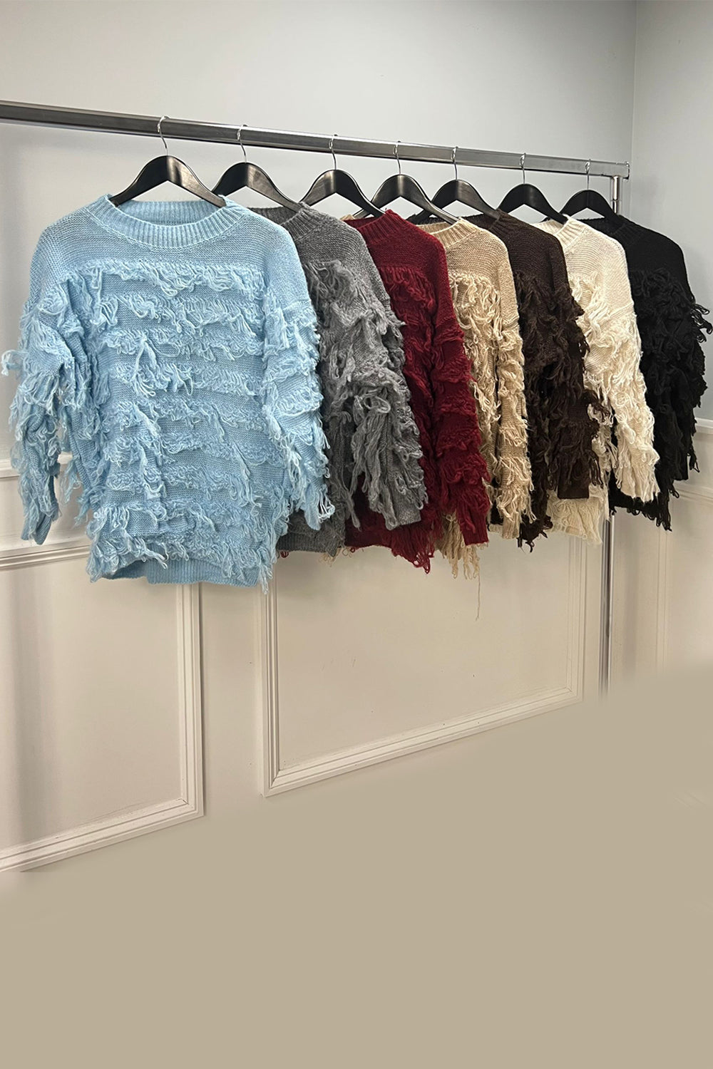 round neck ,oversized knit jumper fringed effect across the front, sleeves, and back