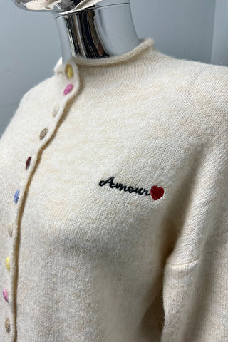 Cream cardigan with rainbow buttons