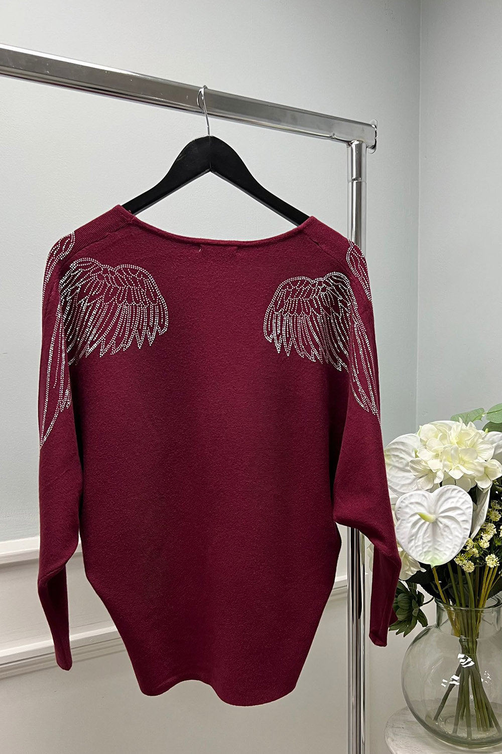 V-neck , long sleeves , oversized Jumper with wing detailing