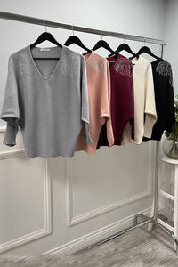 V-neck , long sleeves , oversized Jumper with wing detailing