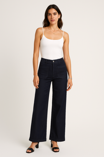 Refined minimalism — high-rise dark denim with front pockets and a sleek wide-leg silhouette