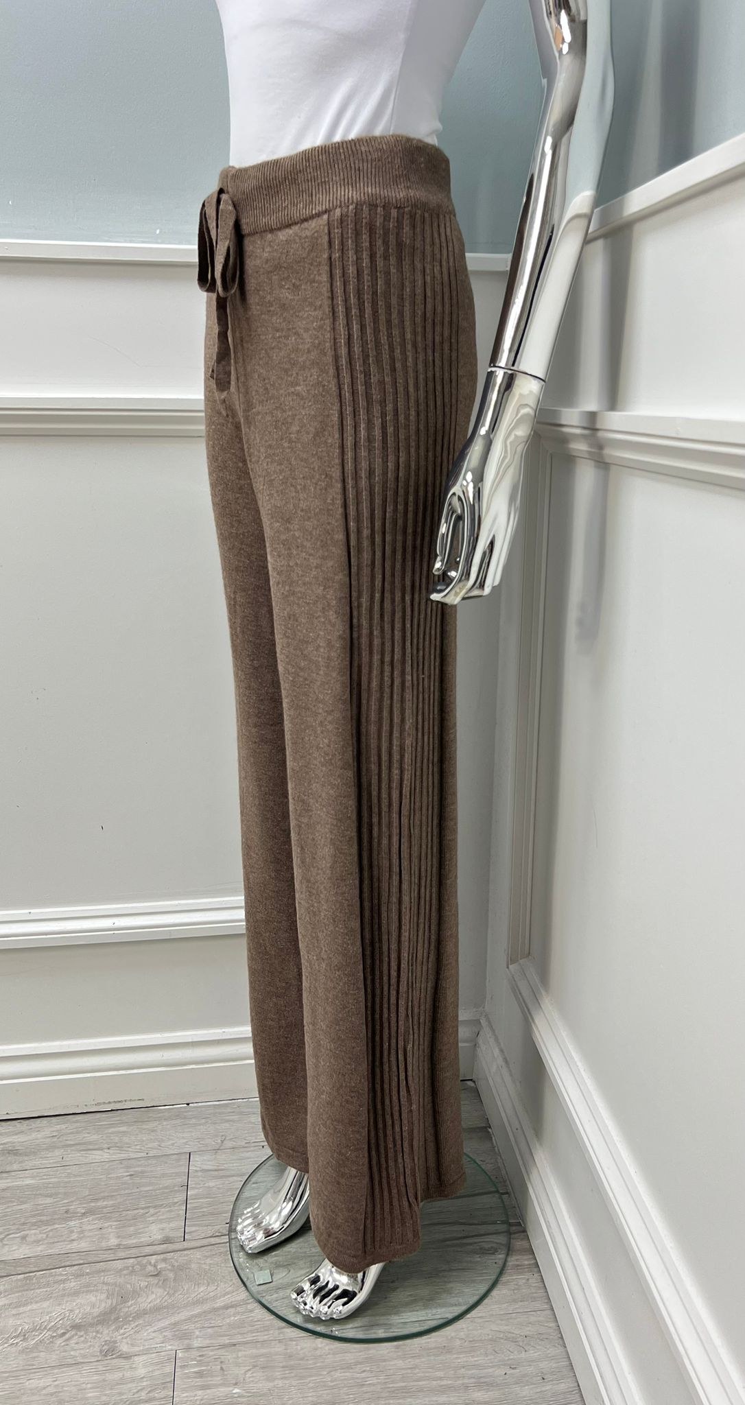 high-waisted, wide-leg knitted trouser with an adjustable drawstring tie at the front