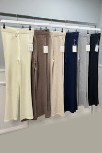 high-waisted, wide-leg knitted trouser with an adjustable drawstring tie at the front