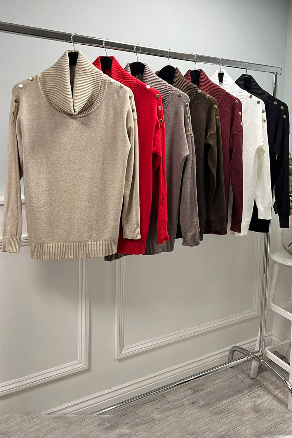 Relaxed fit , wide ribbed high neck jumper with Button detail