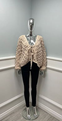 Cable-knit cardigan with tie-front detail and balloon sleeves