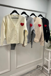 V-neck and button-down front cardigan with a red heart patch