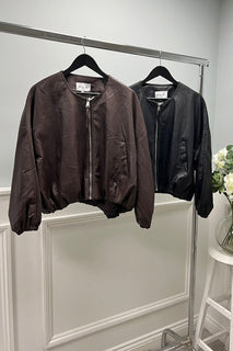 Sleek leather jacket with a minimalist zip-front and tailored ease.