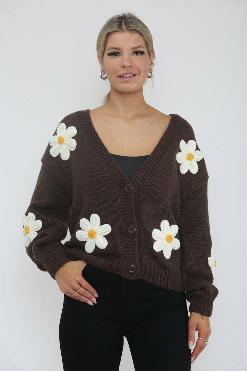 Cardigan – Cozy knit, playful floral details.