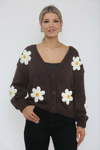 Cardigan – Cozy knit, playful floral details.
