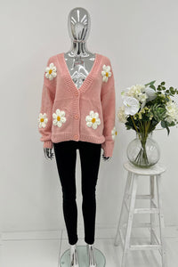 Cardigan – Cozy knit, playful floral details.