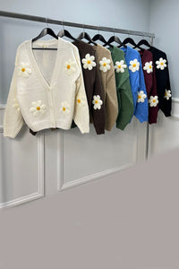 Cardigan – Cozy knit, playful floral details.